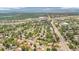 Scenic aerial shot capturing a residential area with tree-lined streets, buildings, and distant mountains at 8759 Seton St, Westminster, CO 80031