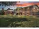 Expansive backyard featuring a spacious lawn and exterior views of the deck, stairs, and fencing at 8759 Seton St, Westminster, CO 80031