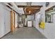 Unfinished basement utility area with exposed pipes, water heater and laundry hookups at 8759 Seton St, Westminster, CO 80031