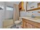 Well-lit bathroom with a vanity, cabinet and shower-tub combo, ideal for relaxing at 8759 Seton St, Westminster, CO 80031