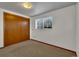 Bedroom features carpeted floor, one window, and a sliding closet door at 8759 Seton St, Westminster, CO 80031