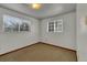 Neutral carpeted bedroom features natural light through two windows at 8759 Seton St, Westminster, CO 80031