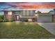 Charming brick home with a well-manicured lawn, two-car garage, and inviting entrance at 8759 Seton St, Westminster, CO 80031