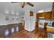 Open concept living area with hardwood floors, updated kitchen and view to the living room at 8759 Seton St, Westminster, CO 80031