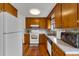 Well-lit kitchen featuring wood cabinets, matching appliances, and modern countertops at 8759 Seton St, Westminster, CO 80031