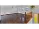 Spacious living area featuring hardwood floors, three windows and a hanging plant at 8759 Seton St, Westminster, CO 80031