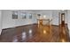 Bright living room with hardwood floors, wooden staircase, and access to other living spaces at 8759 Seton St, Westminster, CO 80031