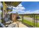 Relaxing balcony with a grill, offering scenic views and outdoor enjoyment at 9019 E Panorama Cir # D218, Englewood, CO 80112