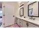 Luxurious bathroom featuring double sinks, quartz countertops, and modern black fixtures at 9019 E Panorama Cir # D218, Englewood, CO 80112