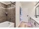 Modern bathroom with tiled shower, stylish vanity, and wood-look flooring at 9019 E Panorama Cir # D218, Englewood, CO 80112