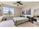 Cozy bedroom with a large window offering natural light and comfortable decor at 9019 E Panorama Cir # D218, Englewood, CO 80112