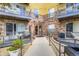 Close-up view of the building entrance with brick accents, disability access, and secure entry system at 9019 E Panorama Cir # D218, Englewood, CO 80112