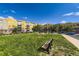 Well-maintained apartment complex with green space, benches, and street parking for convenience and relaxation at 9019 E Panorama Cir # D218, Englewood, CO 80112