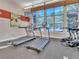 Fitness center with treadmills and an elliptical machine with large windows overlooking outdoors at 9019 E Panorama Cir # D218, Englewood, CO 80112