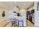 Bright kitchen with an island, bar seating and stainless steel appliances at 9019 E Panorama Cir # D218, Englewood, CO 80112