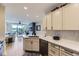 Open kitchen with stainless steel appliances and a view of the bright living room at 9019 E Panorama Cir # D218, Englewood, CO 80112