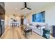 Inviting living room featuring modern decor, sleek hardwood floors, and an open-concept layout to the kitchen at 9019 E Panorama Cir # D218, Englewood, CO 80112