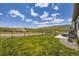 Large grassy backyard with black metal fence and unobstructed views at 15210 W Eastman Ave, Morrison, CO 80465