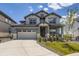 Charming two-story home showcasing a manicured lawn, neutral-toned exterior, and a welcoming front porch at 15210 W Eastman Ave, Morrison, CO 80465