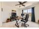 Inviting office featuring a modern desk, computer, and large windows with scenic views at 15210 W Eastman Ave, Morrison, CO 80465