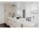 Bright bathroom with double sink vanity, quartz countertop, modern fixtures, and hexagon tile flooring at 2645 Eudora St, Denver, CO 80207