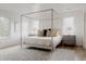 Airy primary bedroom featuring a canopy bed, bedside tables, and natural light from large windows at 2645 Eudora St, Denver, CO 80207