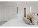 Well-lit bedroom showcases sliding doors, neutral walls, plush carpet, and ensuite bathroom at 2645 Eudora St, Denver, CO 80207