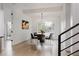 Modern dining room with stylish lighting fixture, large window, and contemporary decor at 2645 Eudora St, Denver, CO 80207