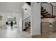 Bright entryway featuring a staircase and access to the dining area, with modern finishes at 2645 Eudora St, Denver, CO 80207