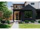 Welcoming front entrance showcases a modern door, wood accents, and well-manicured landscaping at 2645 Eudora St, Denver, CO 80207