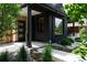 Close-up of the front entrance showing the modern door, house number, and well-maintained landscaping at 2645 Eudora St, Denver, CO 80207