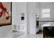 Convenient mudroom area with built-in storage, hooks, and easy access to the kitchen at 2645 Eudora St, Denver, CO 80207