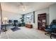 A sunlit room offers versatile space for a home office and is accented by a ceiling fan at 68 S Moline St, Aurora, CO 80012