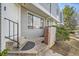 Cozy home entrance with a sturdy railing, neutral siding, and a tidy, well-maintained exterior at 68 S Moline St, Aurora, CO 80012