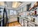Modern kitchen featuring gray cabinets, marble countertops, and stainless steel appliances at 68 S Moline St, Aurora, CO 80012