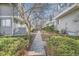 Walkway with green hedges between rows of townhomes at 68 S Moline St, Aurora, CO 80012