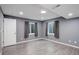 Finished basement bedroom with gray walls, light wood floors, recessed lighting, and two egress windows at 1150 W 127Th Ct, Denver, CO 80234