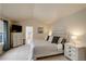 Spacious bedroom with vaulted ceilings, carpet, a large window, and ensuite bathroom entrance at 1150 W 127Th Ct, Denver, CO 80234