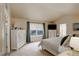Spacious bedroom with vaulted ceilings, a large window, carpet, and light neutral paint at 1150 W 127Th Ct, Denver, CO 80234