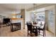 Charming dining area featuring a fireplace, a table set for four, and a bright window at 1150 W 127Th Ct, Denver, CO 80234
