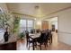 Elegant dining room featuring a table set for six, hardwood floors, a large window, and tasteful decor at 1150 W 127Th Ct, Denver, CO 80234