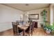 Dining room with seating for six, hardwood floors, stylish pendant lighting, and tasteful decorations at 1150 W 127Th Ct, Denver, CO 80234