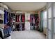 Walk-in closet filled with clothing, shelves, and plenty of storage space, with a window at 1150 W 127Th Ct, Denver, CO 80234