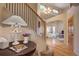 Inviting home entryway with staircase and access to living room with large windows at 1334 Solitude Ln, Evergreen, CO 80439