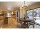 Well-lit open kitchen with stainless steel appliances and an adjacent dining area at 1334 Solitude Ln, Evergreen, CO 80439