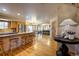 Open kitchen with stainless steel appliances, a large island, and hardwood floors at 1334 Solitude Ln, Evergreen, CO 80439