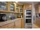 Modern kitchen with stainless steel appliances, granite countertops, and custom cabinetry at 1334 Solitude Ln, Evergreen, CO 80439