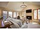 Bright living room with large windows, fireplace, and comfortable seating at 1334 Solitude Ln, Evergreen, CO 80439