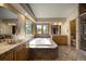 Luxurious bathroom featuring a soaking tub, tiled flooring, double sinks, and mountain views at 1334 Solitude Ln, Evergreen, CO 80439