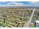 Expansive aerial view of a peaceful residential neighborhood with mature trees and convenient access to a bustling city at 3485 S Forest St, Denver, CO 80222